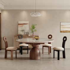 a dining table with four chairs around it