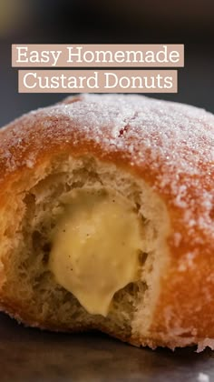 a powdered doughnut with butter on it is sitting on a counter top and has been partially eaten