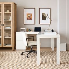 a white desk and chair in a room