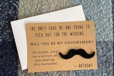 a piece of paper with a card saying,'she only gave me one thing to pick out for the wedding will you be my groom? '