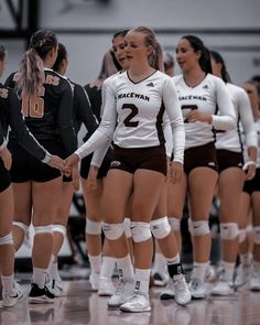 the volleyball team is lined up for their match