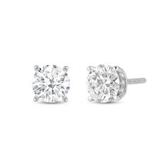 This pair of studs is simplicity redefined. Each earring features a stunning diamond secured by four sleek and elegant claw prongs. View the earrings from the side or at an angle to view the hidden halo that adds extra sparkle to these earrings. Turn to this pair when you want to add an element of glitter to your everyday ensembles. Modern Single Diamond Round Cut Earrings, Classic Solitaire Cubic Zirconia Earrings, Classic Round Cut Lab Grown Diamond Earrings, Classic Diamond Earrings With Prong Setting For Formal Occasions, Classic Lab Grown Diamond Earrings, Classic Single Diamond White Earrings, Classic Single Diamond Lab Grown Diamond Earrings, Classic Single Diamond Round Cut Earrings, Classic Single Diamond Earrings In Lab Grown Diamond