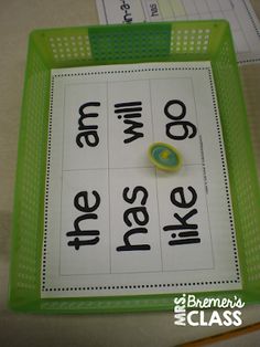 a close up of a green tray with words on it and an object in the middle