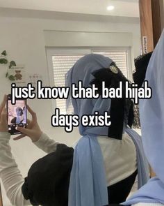 a woman taking a selfie with her cell phone while wearing a hijab