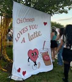 a sign that says chi omega loves you 4 latte