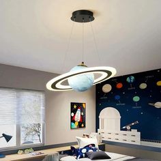 a child's bedroom with a space theme painted on the wall