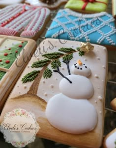 decorated cookies with frosting and icing are on display for the guests to enjoy