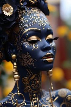 a woman with blue face paint and flowers in her hair