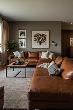 a living room filled with lots of brown furniture