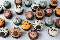 many cupcakes are decorated with animals and zebras