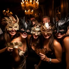 a group of people wearing masks posing for the camera