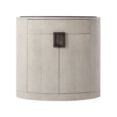 a round cabinet with an open door on the front and side, in grey linen