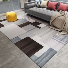 an image of a living room scene with couches and rugs on the floor