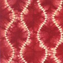 a red and white tie - dye pattern is shown in this image, it appears to be very intricate