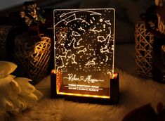 a night light with stars on it sitting next to some vases and other decorations