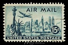 an air mail stamp with the statue of liberty