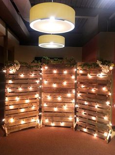 several wooden pallets with lights on them