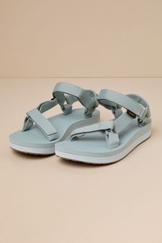 However you style the Teva Midform Universal Pearl Blue Sandals, they are sure to make any of your summer 'fits even more cute and comfortable! These sandals feature recycled REPREVEÂ® polyester yarn by UnifiÂ®, which shapes an adjustable VELCROÂ® toe strap that leads to a matching quarter strap. An on-trend, color block flatform foam sole completes the summer-ready look! Logo tag accents outstep strap. Available in whole sizes only. 1. 25" flatform sole. Lightly cushioned insole. Felted foam so Nylon Open Toe Beach Sandals, Beach-ready Open Toe Nylon Sandals, Nylon Open Toe Sandals For Beach, Nylon Open Toe Sandals For Vacation, Open Toe Nylon Sandals For Vacation, Nylon Sandals For Summer Vacation, Summer Nylon Open Toe Sport Sandals, Open Toe Nylon Sport Sandals For Summer, Summer Open Toe Nylon Sport Sandals