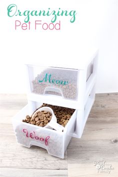 an open pet food dispenser sitting on top of a wooden table