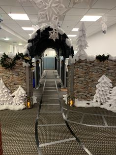 a long hallway decorated with snow and trees