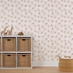 the wallpaper in this room is pink and has flowers on it, along with wicker baskets