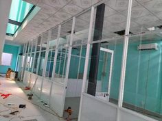 an empty room with glass walls and lots of wires