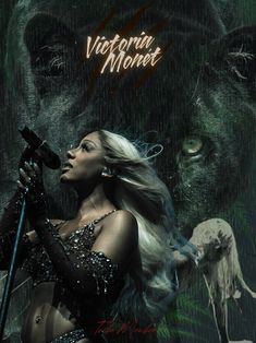 a woman holding a microphone in front of a black bear with the words victoria monroe on it