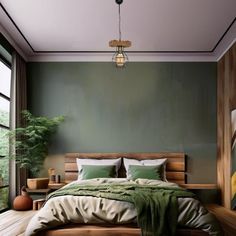 a bedroom with green walls and wooden flooring has a large bed in the middle