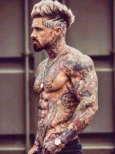 a man with many tattoos on his body