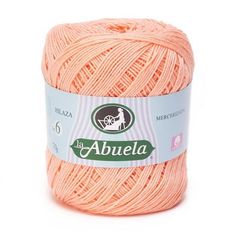 an orange ball of yarn with the label abuela on it's side