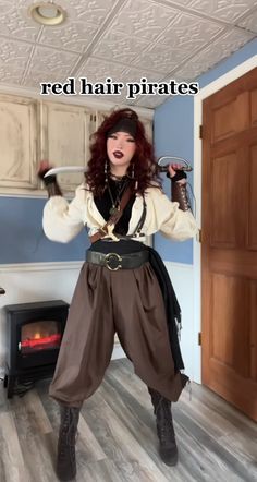 a woman with red hair and pirate costume holding a hammer in her hand while standing on the floor