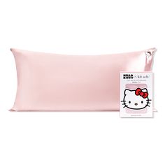 the hello kitty pillow case is next to it's packaging