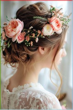 a woman with flowers in her hair is wearing a flower headpiece on her wedding day