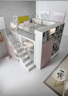 a room that has some shelves and stairs inside of it with bookshelves on the wall