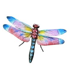 a colorful dragonfly sitting on top of a white surface