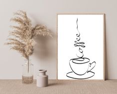 a black and white drawing of a coffee cup on a table next to a vase