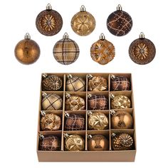 a box filled with assorted christmas ornaments on top of a white surface and surrounded by smaller boxes