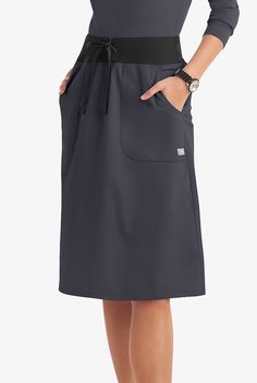 Our a-line scrub skirt gets an a+ from customers. Most-mentioned features? Perfect length. Classic but not “old-fashioned” style. Just-right fit. The comfy knit waistband. And it’s very easy to move in! each piece in our Butter-soft Stretch scrub collection was designed for 12+ hour shifts, and made from easy-care, 2-way stretch comfort fabric. • Classic fit • Natural wasited • A-line • Drawstring rib waistband • Knee length • 2 patch pockets • Approximate length for size M is 27” The key to com Scrub Skirt, Scrub Skirts, Scrub Collection, 12 Hour Shifts, Dickies Scrubs, Uniform Advantage, Healing Hands, Medical Uniforms, Move In