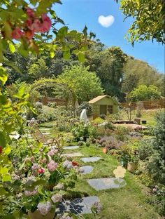 the garden is full of flowers and plants