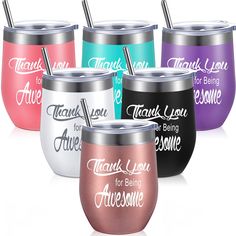 there are many different colored tumblers with straws in each one and the words thank you for being awesome on them