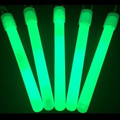 glow sticks are glowing green in the dark