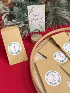 the table is set up with brown paper tags and place cards for guests to use