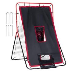 a black and red baseball batting cage with the door open to it's side