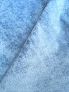 a close up view of a blue fabric