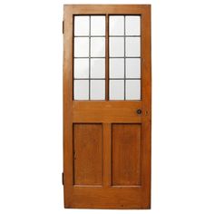 an old wooden door with glass panels