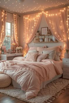 a bedroom decorated in pink and white with fairy lights