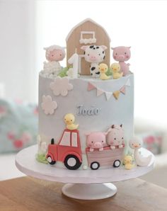 a birthday cake with farm animals on it