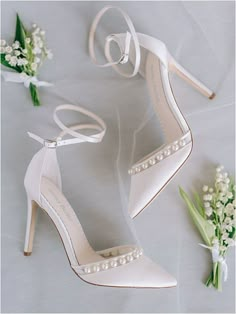 the bride's shoes and boutonnieres are on display next to each other