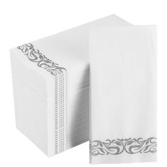 a stack of white napkins on top of each other