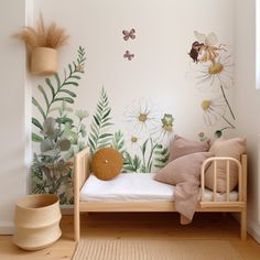 a room with flowers and plants painted on the wall next to a small wooden bed